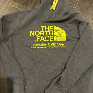 The North Face Charcoal Hoodie with Vibrant Yellow Accents
